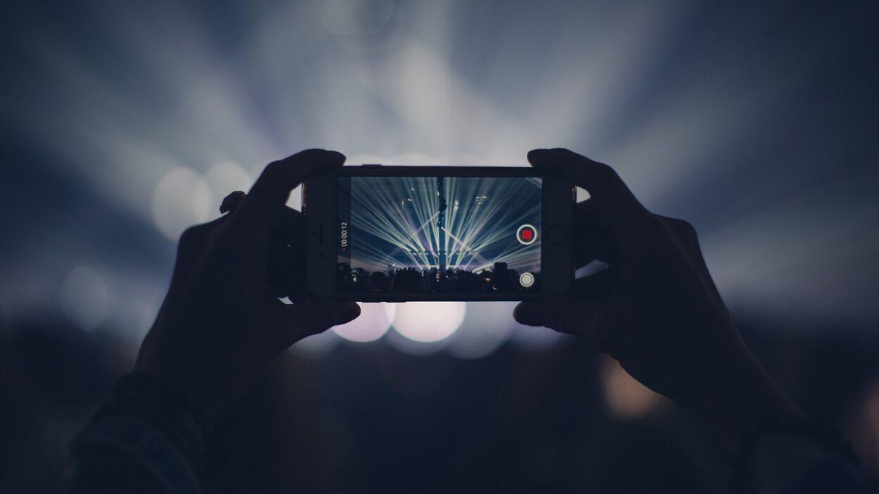 iphone, concert, lights, stage lights, record, video, recording, video recording, capture, apple product, hands, audience, event, live event, live performance, dark, party, smartphone, crowd, video, video, video, video, video
